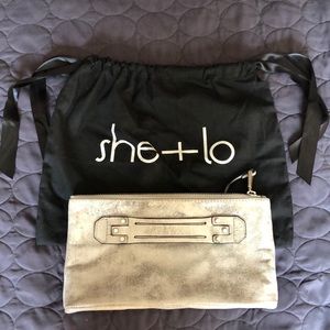 She + Lo Next Chapter silver leather clutch
